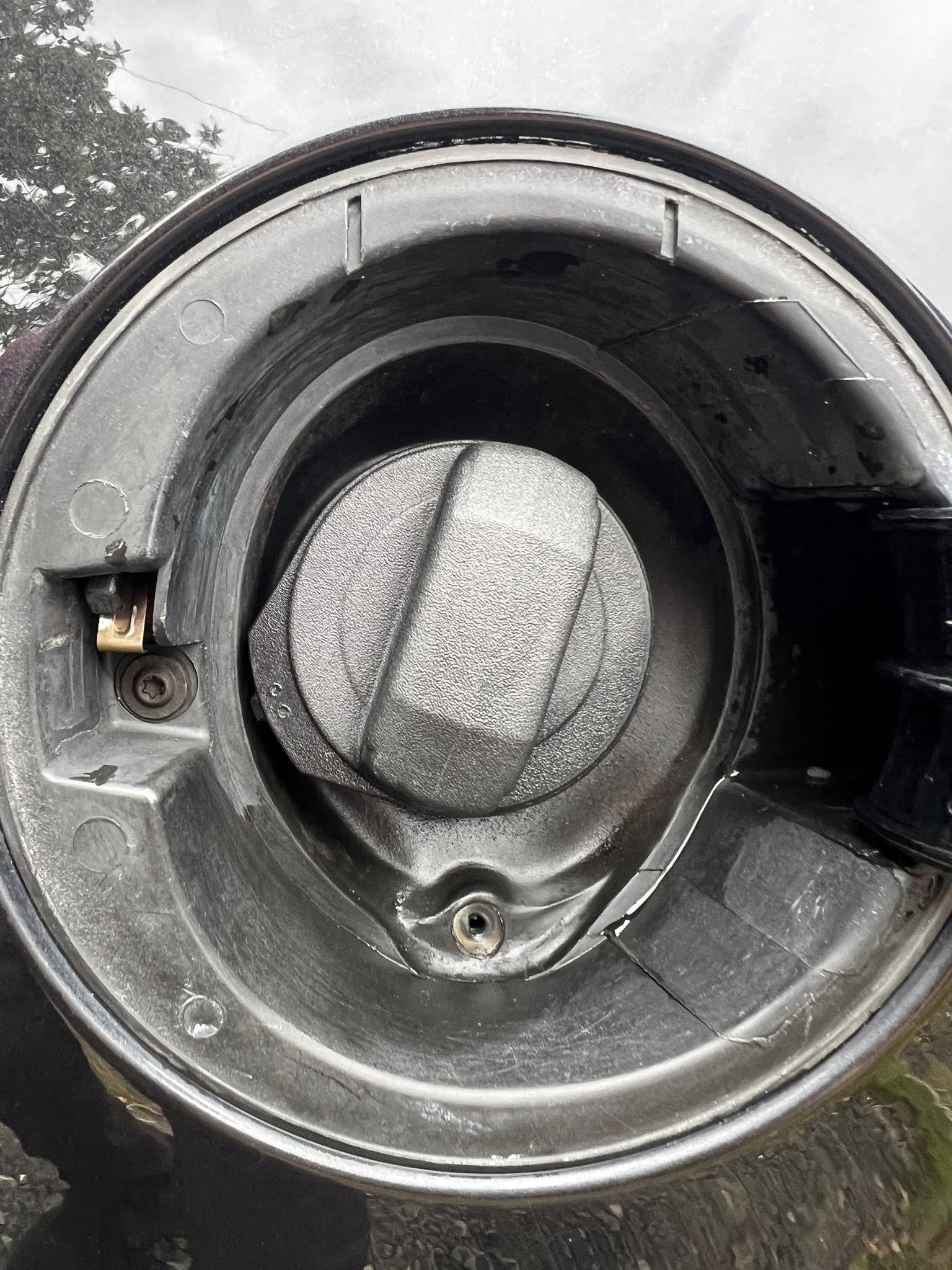 fuel cap previously dirty now cleaned after MC AutoGleam vehicle transformation showing shiny finish Limavady